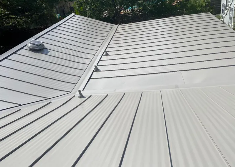 Solar attic fan installed on a metal roof for Roof Ventilation in Pingree Grove